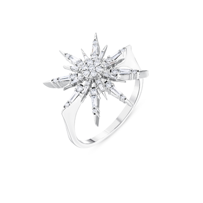 Three-quarter view of the natural diamond starburst ring in 14K white gold showing the plain band and the flat shoulders under the star