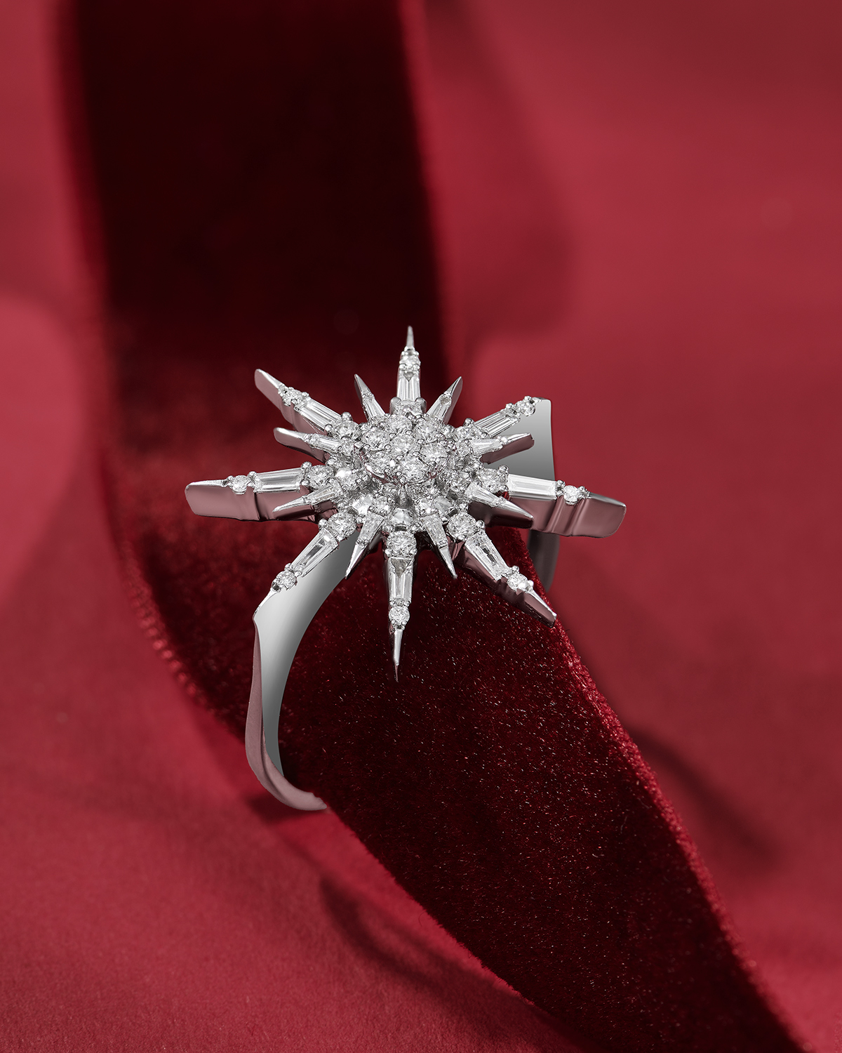 Natural diamond starburst cocktail ring in 14K white gold on red velvet