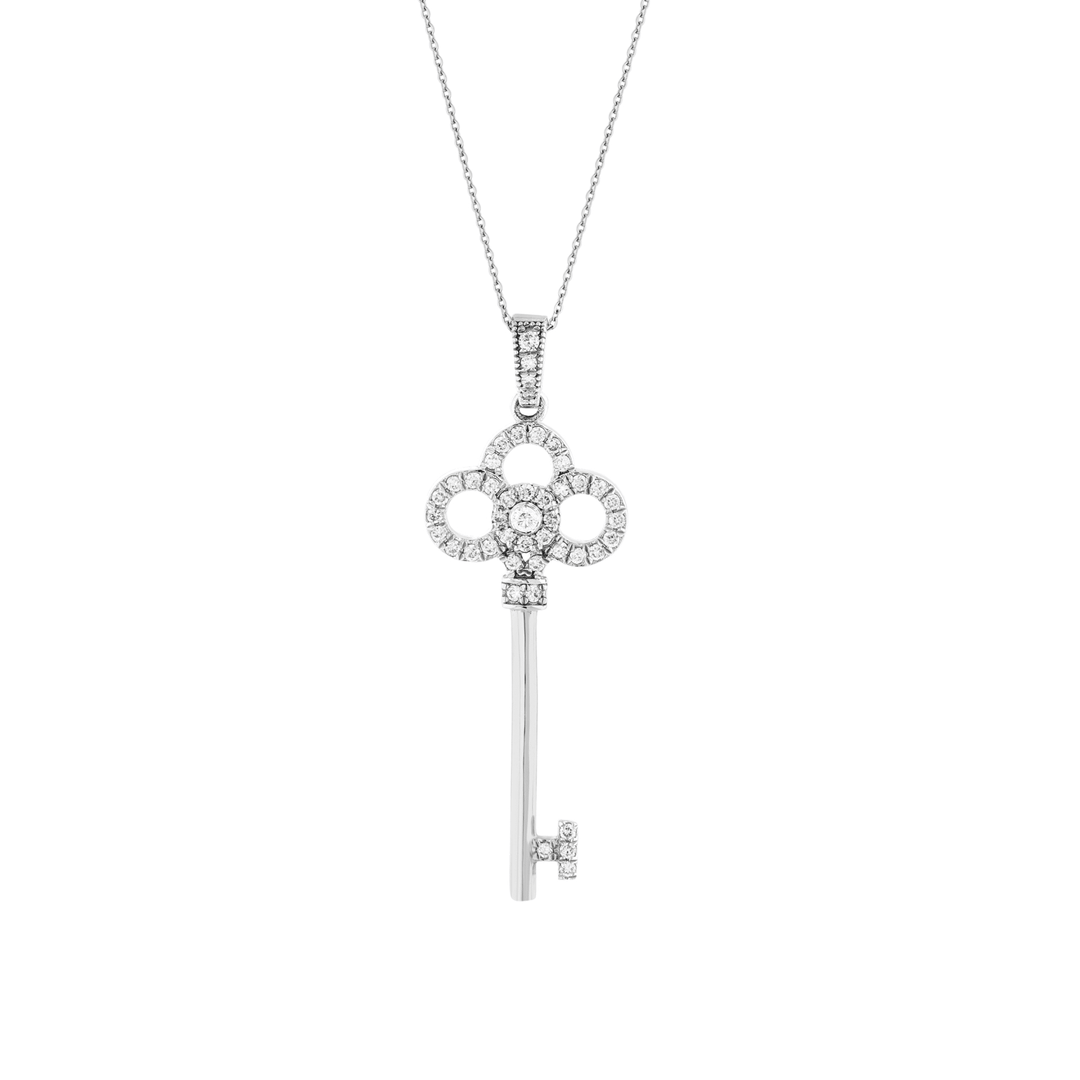 Close-up of the diamond trefoil key pendant: three open diamond rings around a bezel-set diamond, 14K white gold