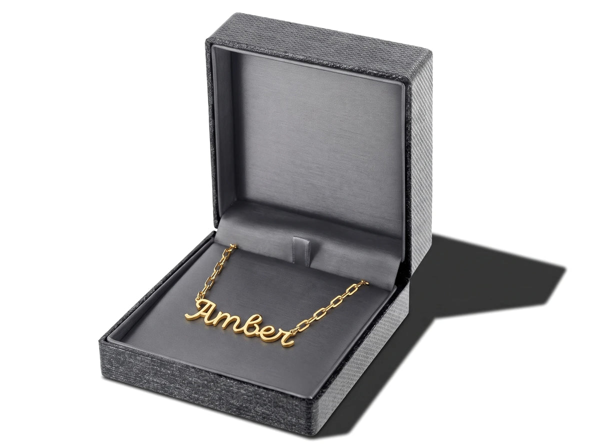 Luxury necklace box with a soft grey lining, shown with a name necklace inside