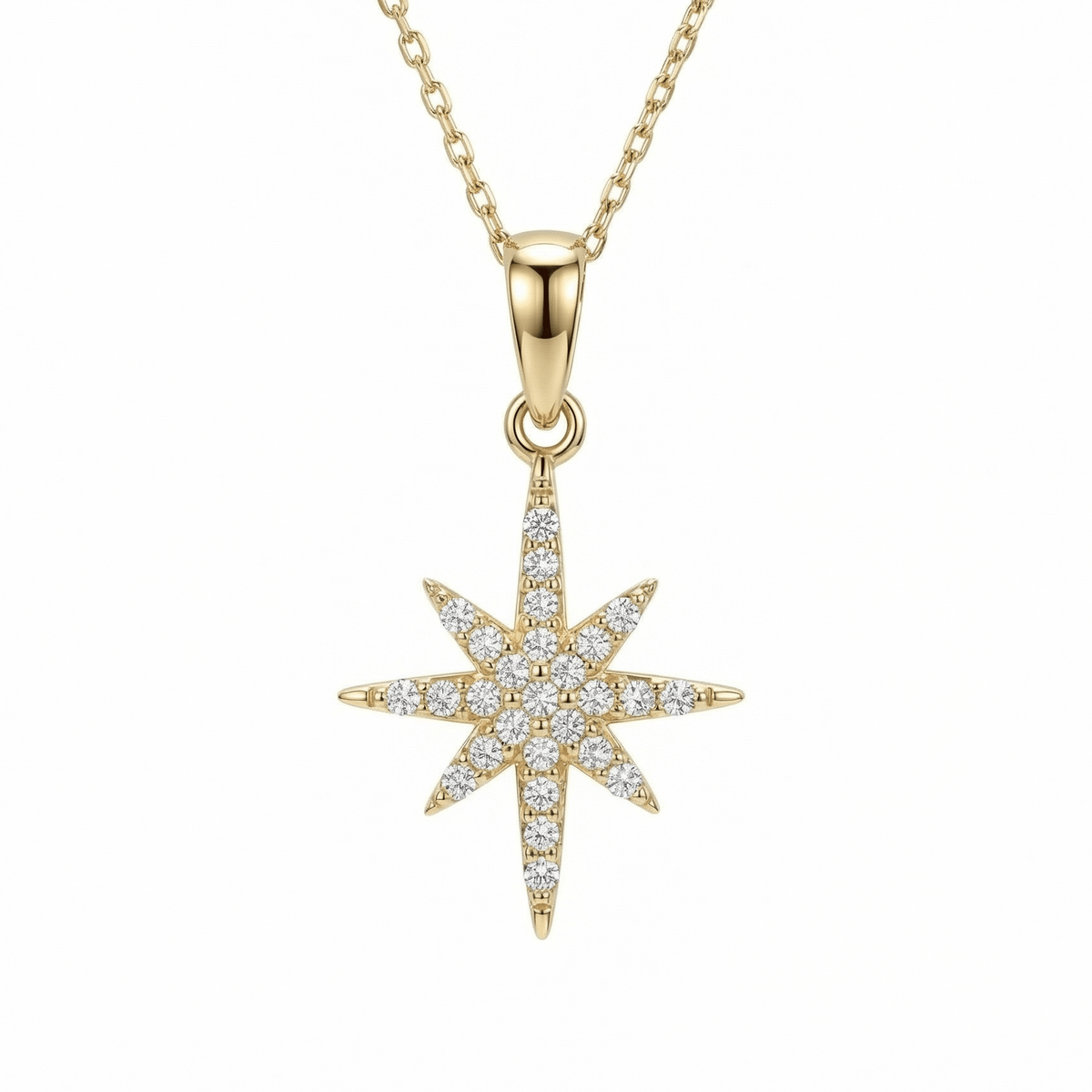North Star Necklace in 14K solid gold, an eight-point star covered in clear CZ stones on a fine cable chain.