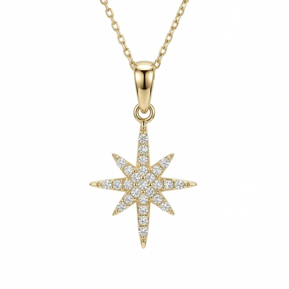 North Star Necklace in 14K solid gold, an eight-point star covered in clear CZ stones on a fine cable chain.
