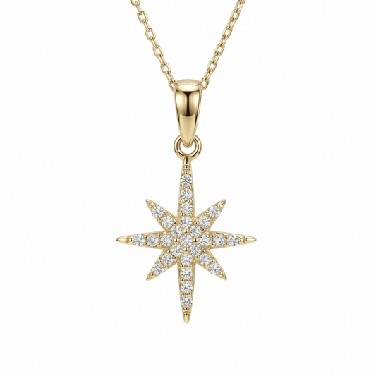 North Star Necklace in 14K solid gold, an eight-point star covered in clear CZ stones on a fine cable chain.