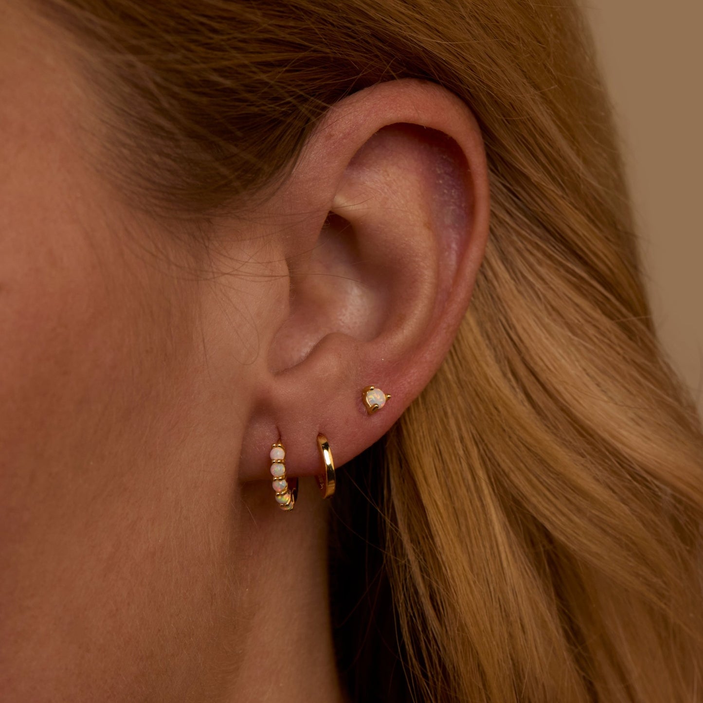 Close detail of the Opal Hoops Studs Earring Set in 18K Gold Vermeil with Opal. Tarnish-resistant, premium handmade jewelry.