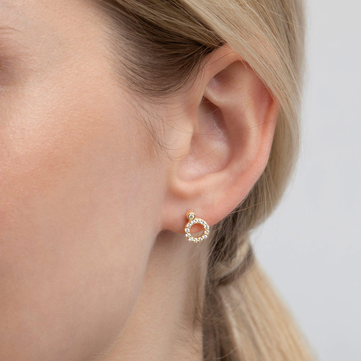 The Pavé Circle Stud Earrings styled in 18K Gold Vermeil — elegant everyday jewelry. Hypoallergenic for sensitive ears.