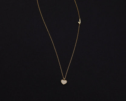 Macro detail of the Pavé Heart Initial Necklace: CZ Diamond set in 18K Gold Vermeil. Tarnish-resistant, handmade jewelry.