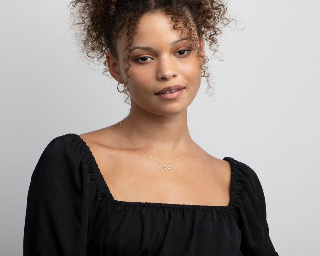 Pavé Infinity Pendant Necklace as a thoughtful birthday gift in 18K Gold Vermeil with CZ Diamond. Hypoallergenic, no green.