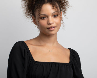 Pavé Infinity Pendant Necklace as a thoughtful birthday gift in 18K Gold Vermeil with CZ Diamond. Hypoallergenic, no green.