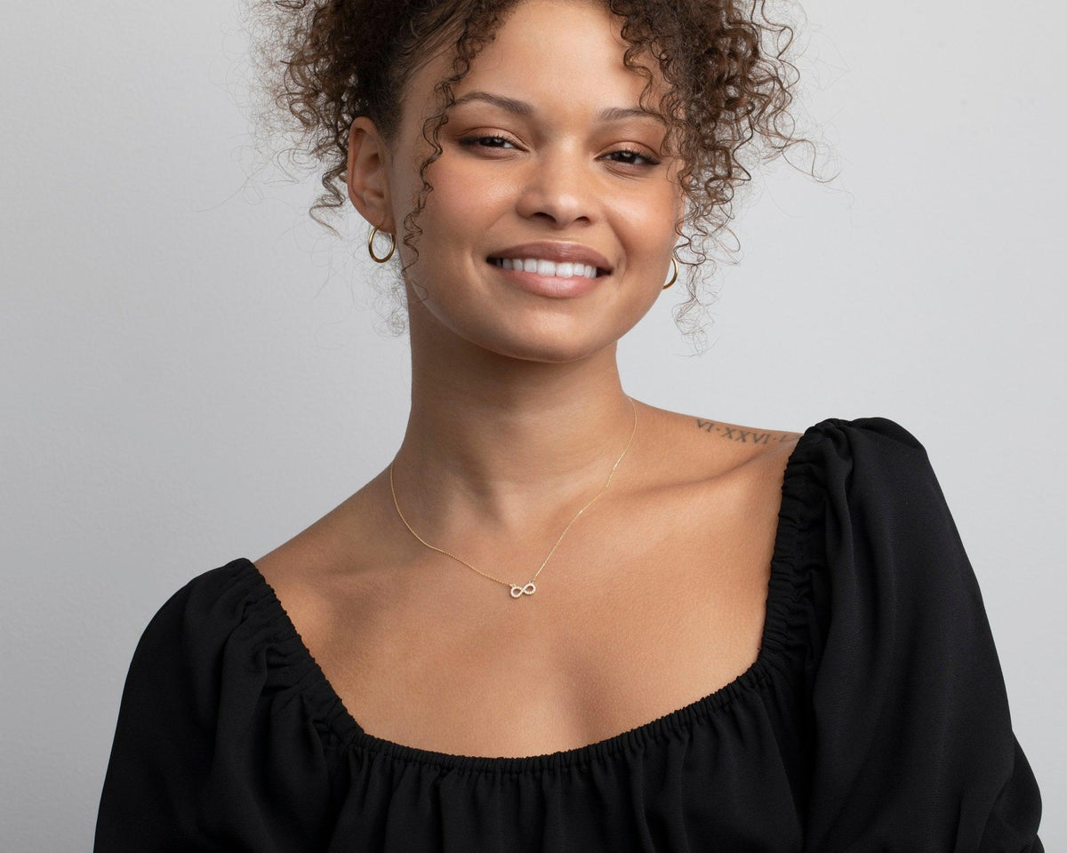 The Pavé Infinity Pendant Necklace styled in 18K Gold Vermeil — elegant everyday jewelry. Hypoallergenic, no green marks.
