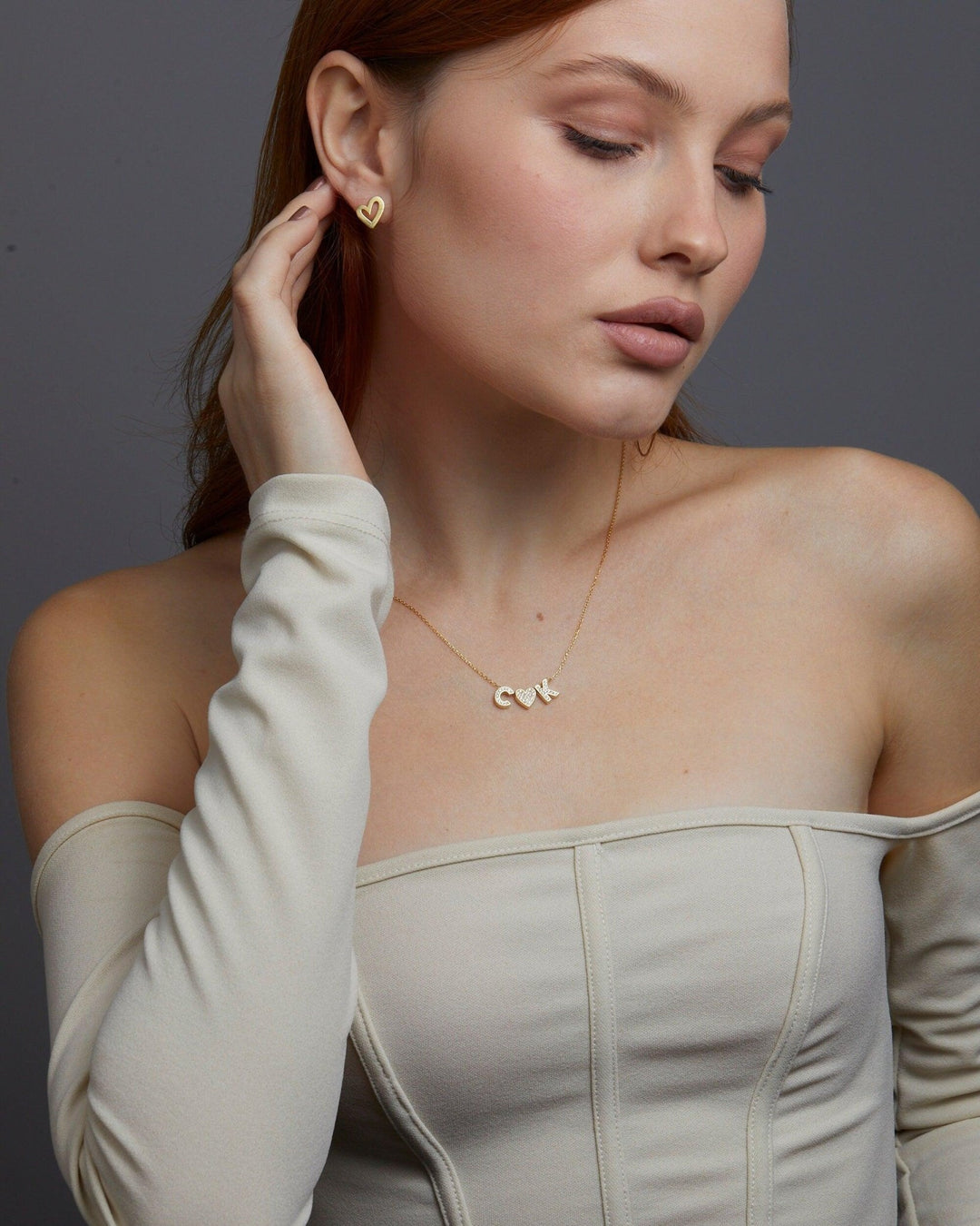 Macro detail of the Pavé Initial Necklace: CZ Diamond set in 18K Gold Vermeil. Tarnish-resistant, handmade jewelry.