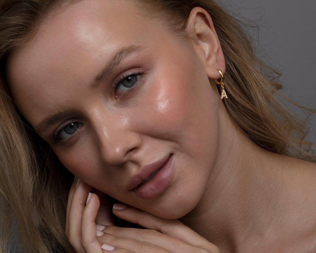 The Pavé Initials Letter Earrings worn in 18K Gold Vermeil — refined accessory for women. Tarnish-resistant.