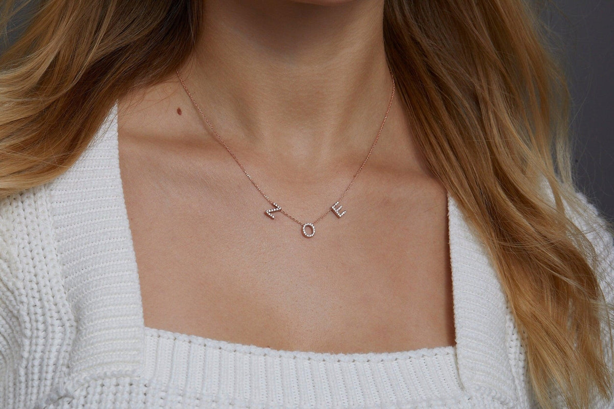 Macro detail of the Pavé Initials Necklace: CZ Diamond set in 18K Gold Vermeil. Tarnish-resistant, handmade jewelry.