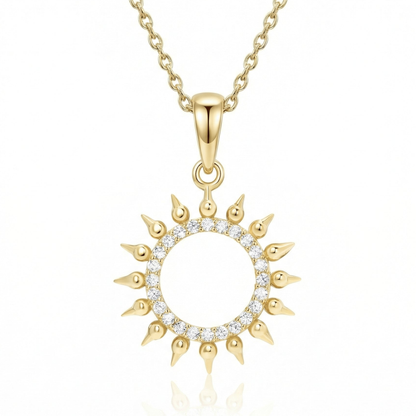 Pavé Sun Necklace in 14K solid gold: an open ring of clear CZ stones with pointed gold rays, on a gold chain.