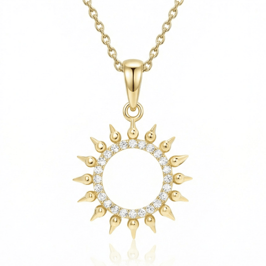 Pavé Sun Necklace in 14K solid gold: an open ring of clear CZ stones with pointed gold rays, on a gold chain.