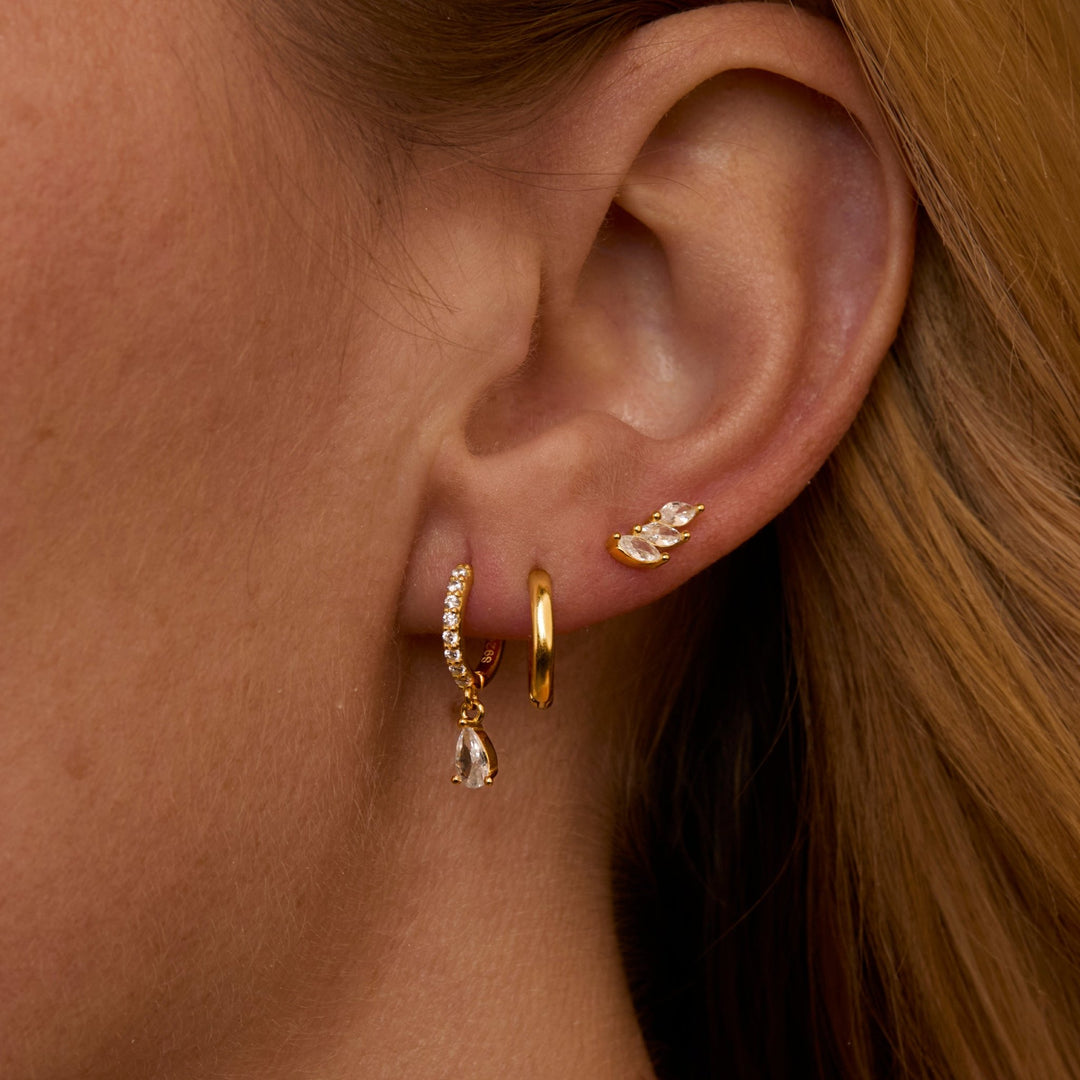 Macro detail of the Pear Drop Marquise Cluster Ear Stack: CZ Diamond set in 18K Gold Vermeil. No green marks, handmade.