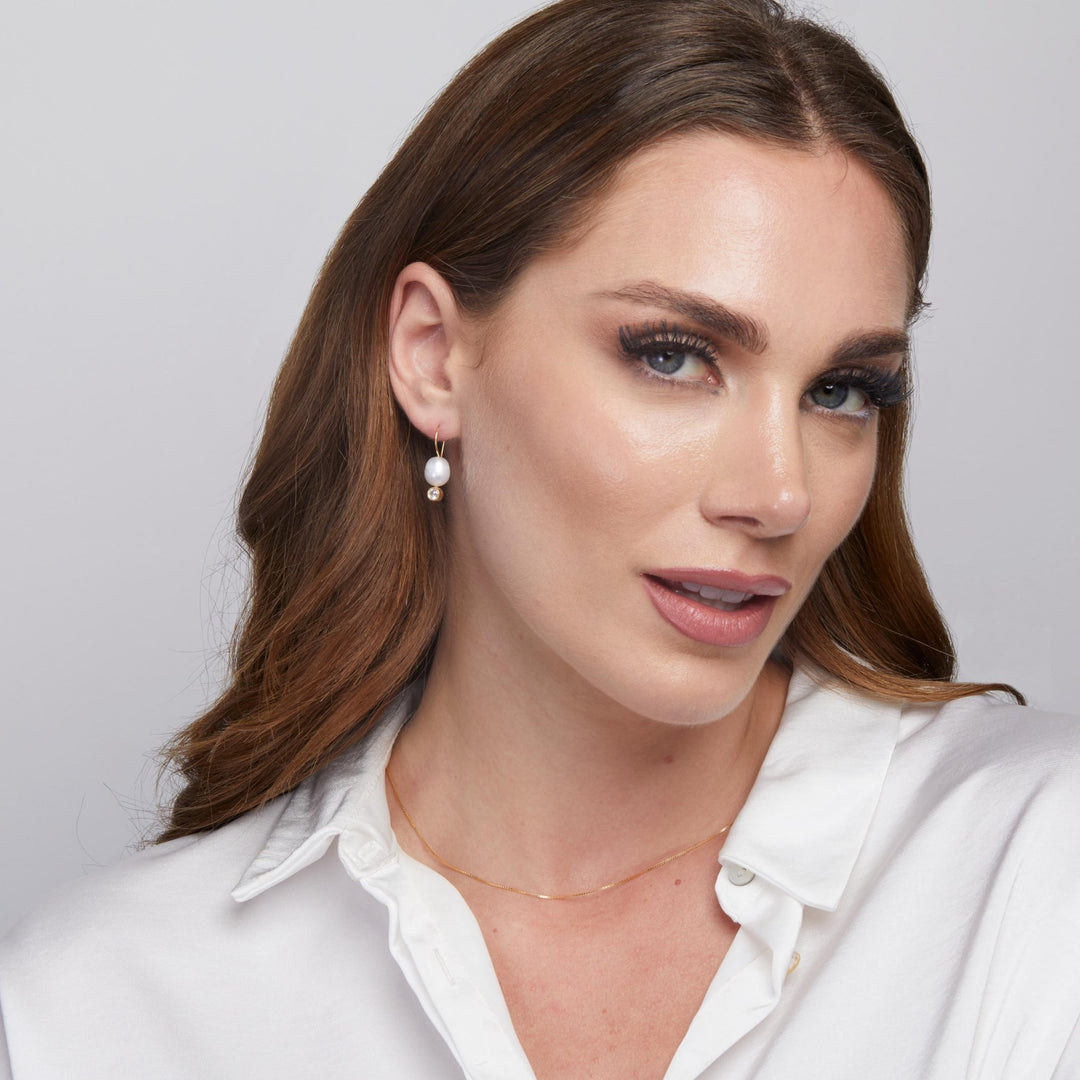 The Pearl Drop Earrings styled in 18K Gold Vermeil — elegant everyday jewelry. Hypoallergenic for sensitive ears.
