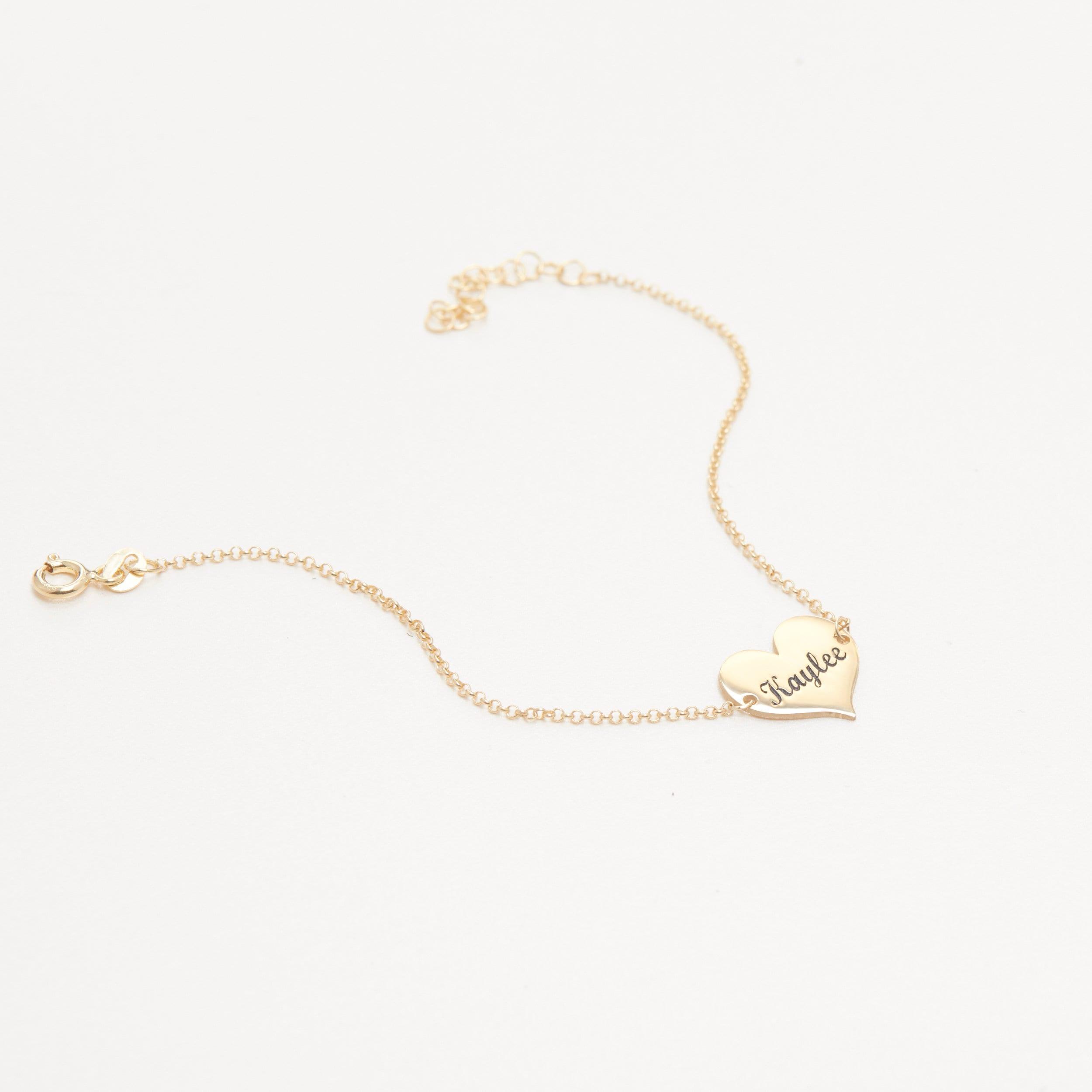 Macro detail of the Personalized Name Bracelet with Heart Charm showcasing craftsmanship in 18K Gold Vermeil.