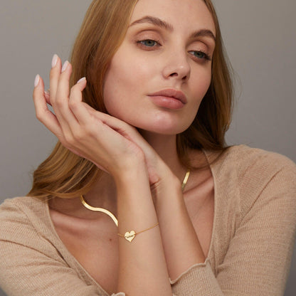The Personalized Name Bracelet with Heart Charm styled in 18K Gold Vermeil — elegant everyday jewelry. Hypoallergenic, no.