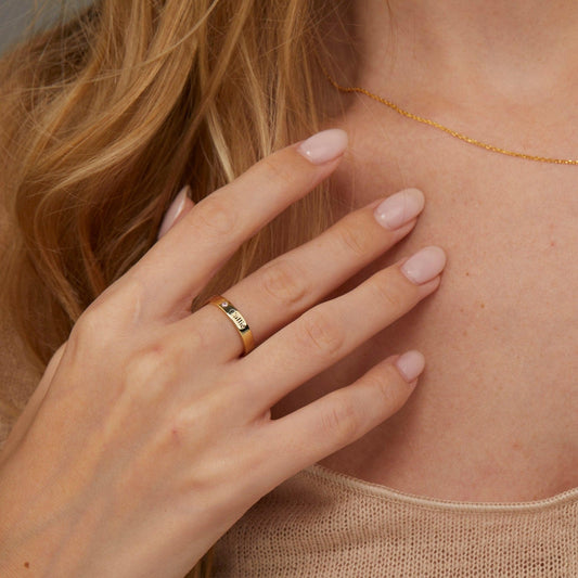 Close detail of the Personalized Name Ring with Birthstone in 18K Gold Vermeil with Birthstone. Hypoallergenic, no green.