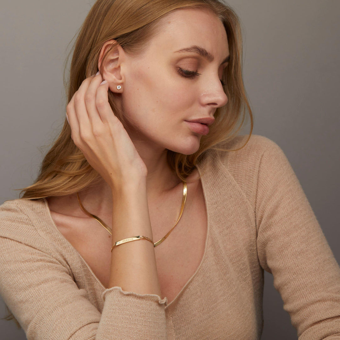 The Silver Name Bracelet with Figaro Chain styled in 18K Gold Vermeil — elegant everyday jewelry. Hypoallergenic, no green.