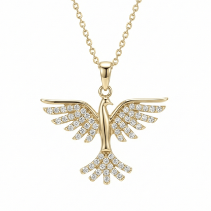 Phoenix pendant necklace in 14K solid gold, with rows of small round CZ stones across the spread wings and fanned tail.