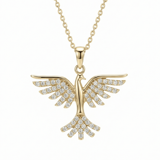 Phoenix pendant necklace in 14K solid gold, with rows of small round CZ stones across the spread wings and fanned tail.