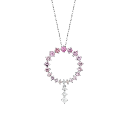 Close-up of the graduated pink gemstone circle and its three natural diamond drop in 14K white gold