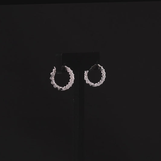360-degree video of the round natural diamond huggie hoop earrings in 14K white gold