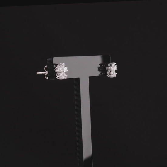 360 degree video of the pear-cut natural diamond flower stud earrings in 14K white gold