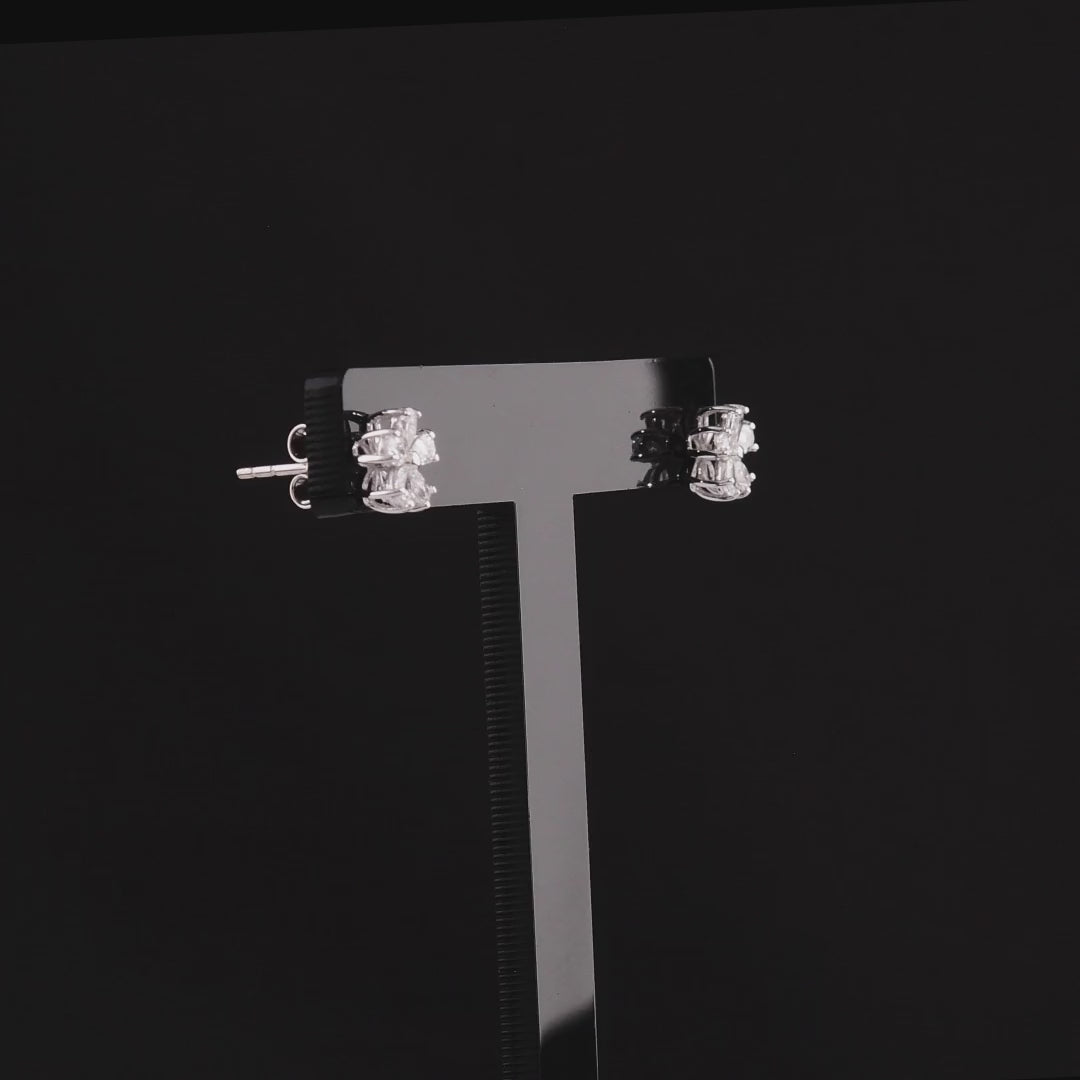 360 degree video of the pear-cut natural diamond flower stud earrings in 14K white gold