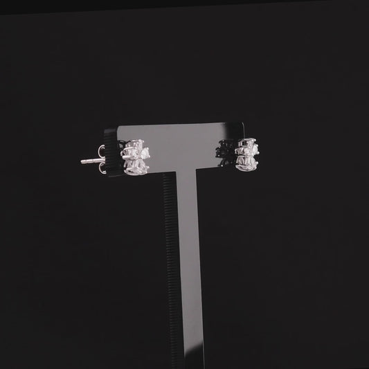 360 degree video of the pear-cut natural diamond flower stud earrings in 14K white gold