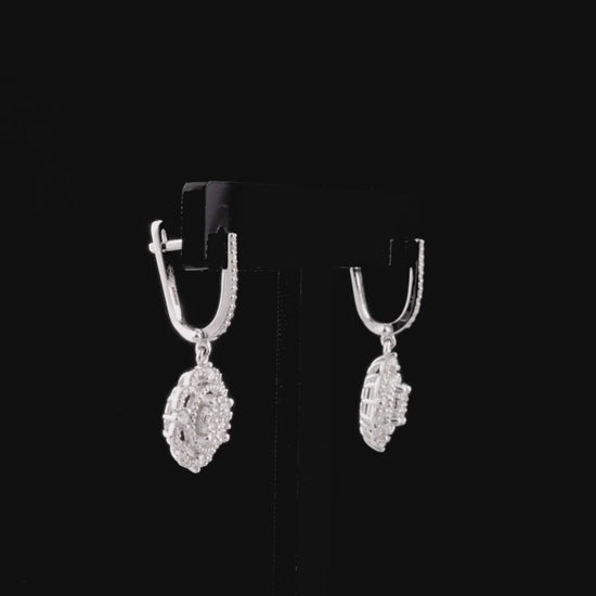 360-degree video of the natural diamond flower halo cluster drop earrings in 14K white gold.
