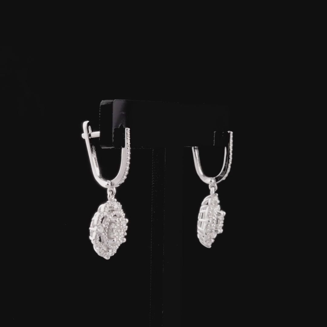 360-degree video of the natural diamond flower halo cluster drop earrings in 14K white gold.