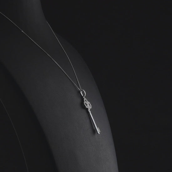 360 degree video of the natural diamond trefoil key pendant necklace in 14K white gold