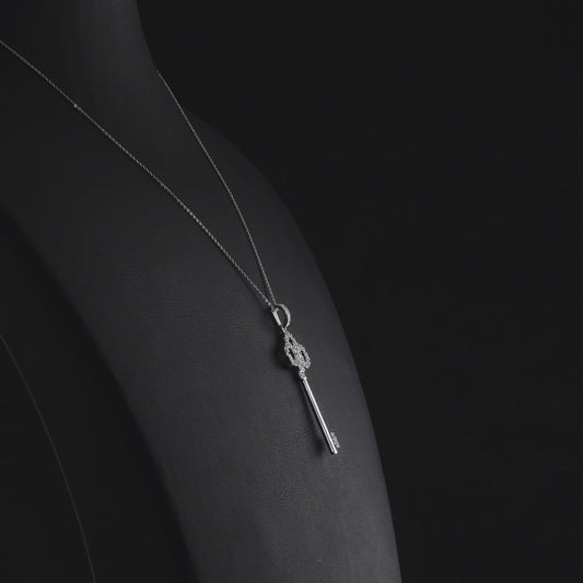 360 degree video of the natural diamond trefoil key pendant necklace in 14K white gold