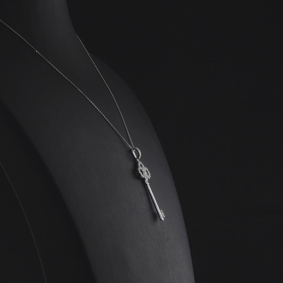 360 degree video of the natural diamond trefoil key pendant necklace in 14K white gold