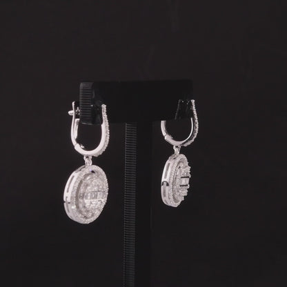 360-degree video of the natural diamond halo disc drop huggie earrings in 14K white gold.