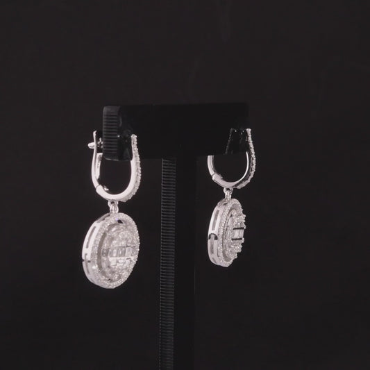 360-degree video of the natural diamond halo disc drop huggie earrings in 14K white gold.