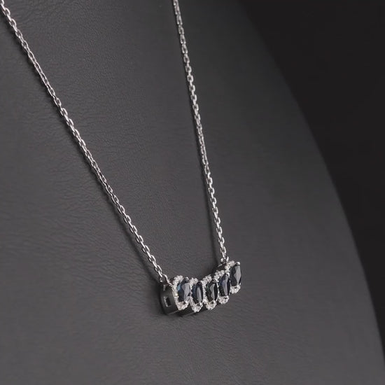 360 degree video of the marquise natural sapphire and diamond halo necklace in 14K white gold