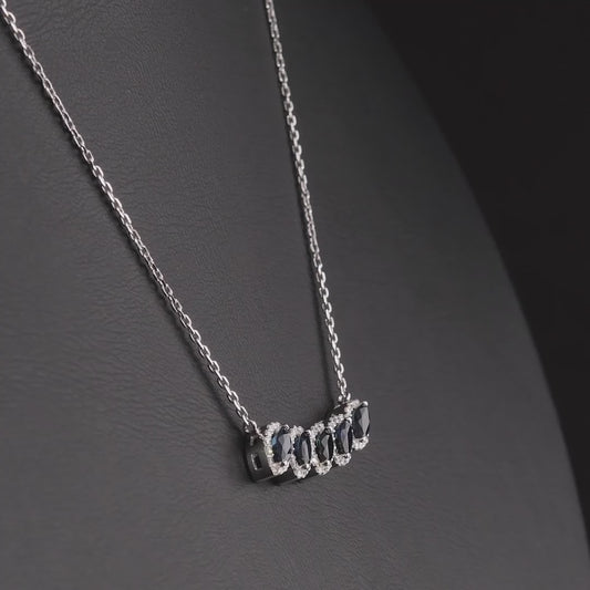 360 degree video of the marquise natural sapphire and diamond halo necklace in 14K white gold