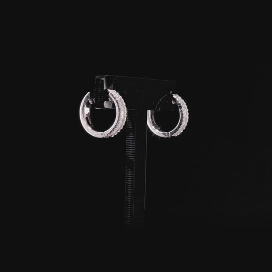 360 degree view of the diamond baguette huggie hoop earrings