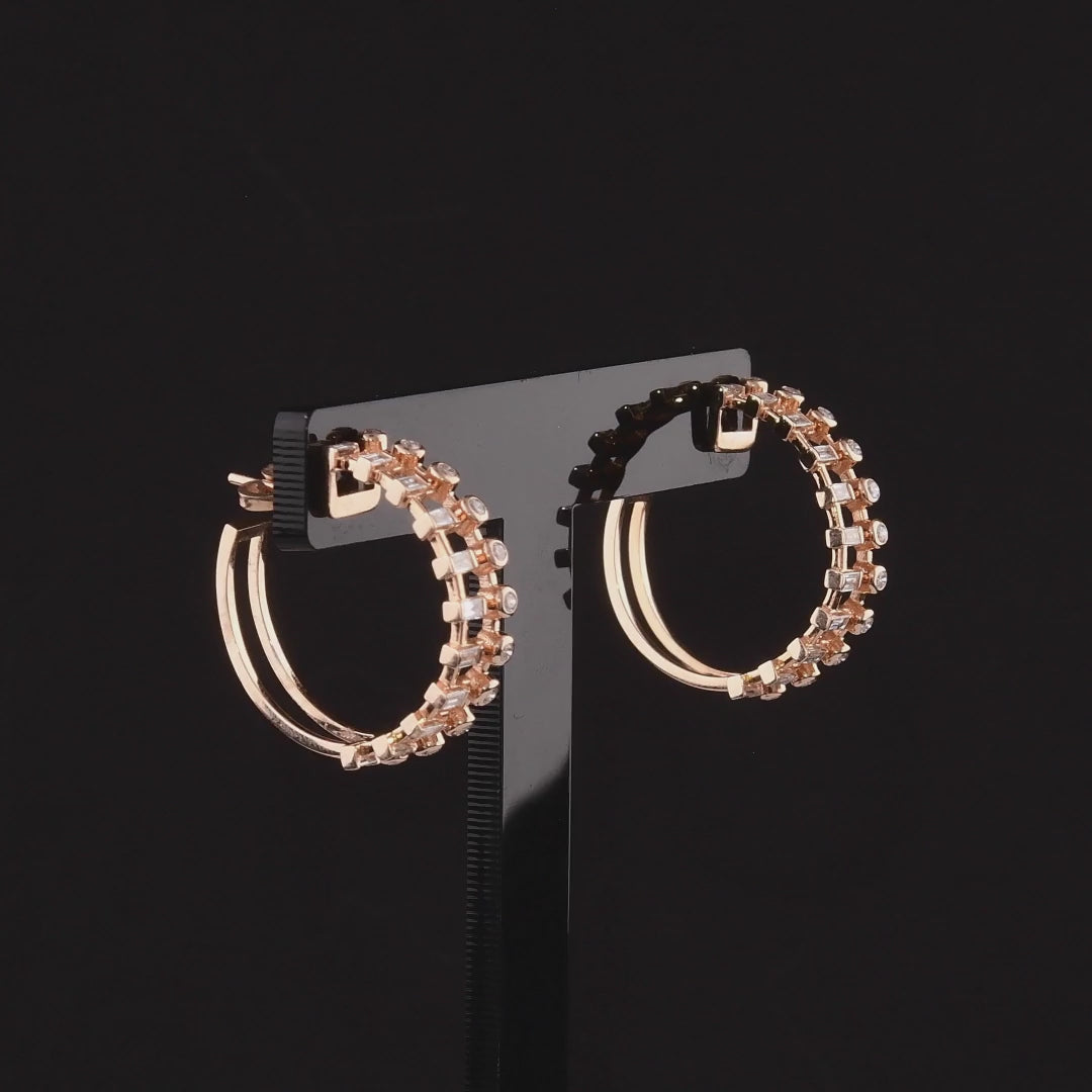 360-degree video of the baguette and round natural diamond ladder hoop earrings in 14K rose gold