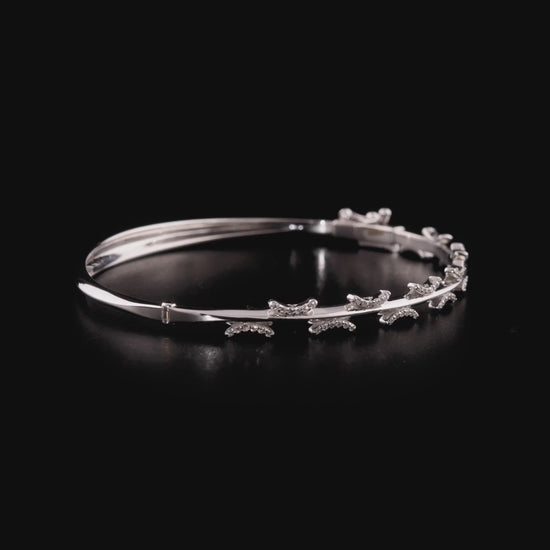 360-degree video of the natural diamond pavé crescent bangle bracelet in 14K solid white gold