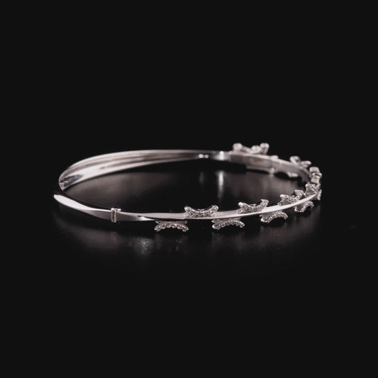360-degree video of the natural diamond pavé crescent bangle bracelet in 14K solid white gold