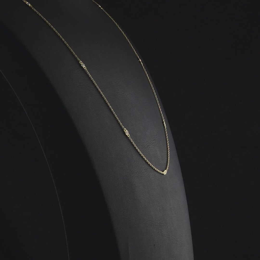 360-degree video of the natural diamond bezel station necklace in 14K yellow gold