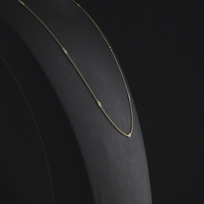 360-degree video of the natural diamond bezel station necklace in 14K yellow gold