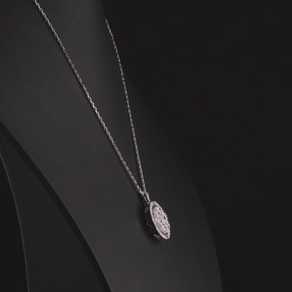 Round diamond cluster halo pendant in 14K white gold turning 360 degrees
