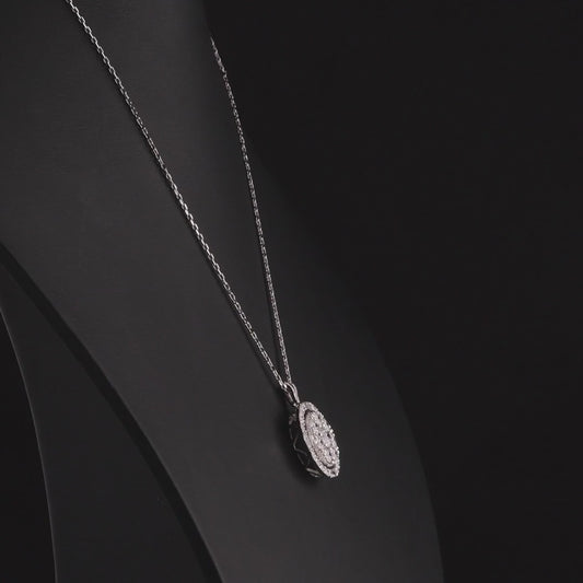 Round diamond cluster halo pendant in 14K white gold turning 360 degrees