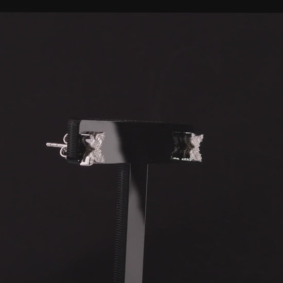 360 degree video of the baguette natural diamond flower stud earrings in 14K white gold