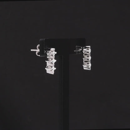 360-degree video of the three-star natural diamond drop stud earrings in 14K white gold